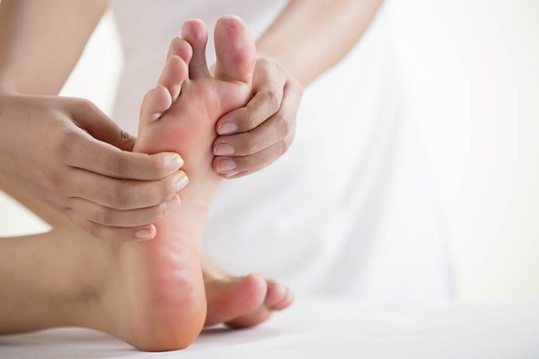 An expert massager doing reflexology treatment at massage centers f10 Islamabad